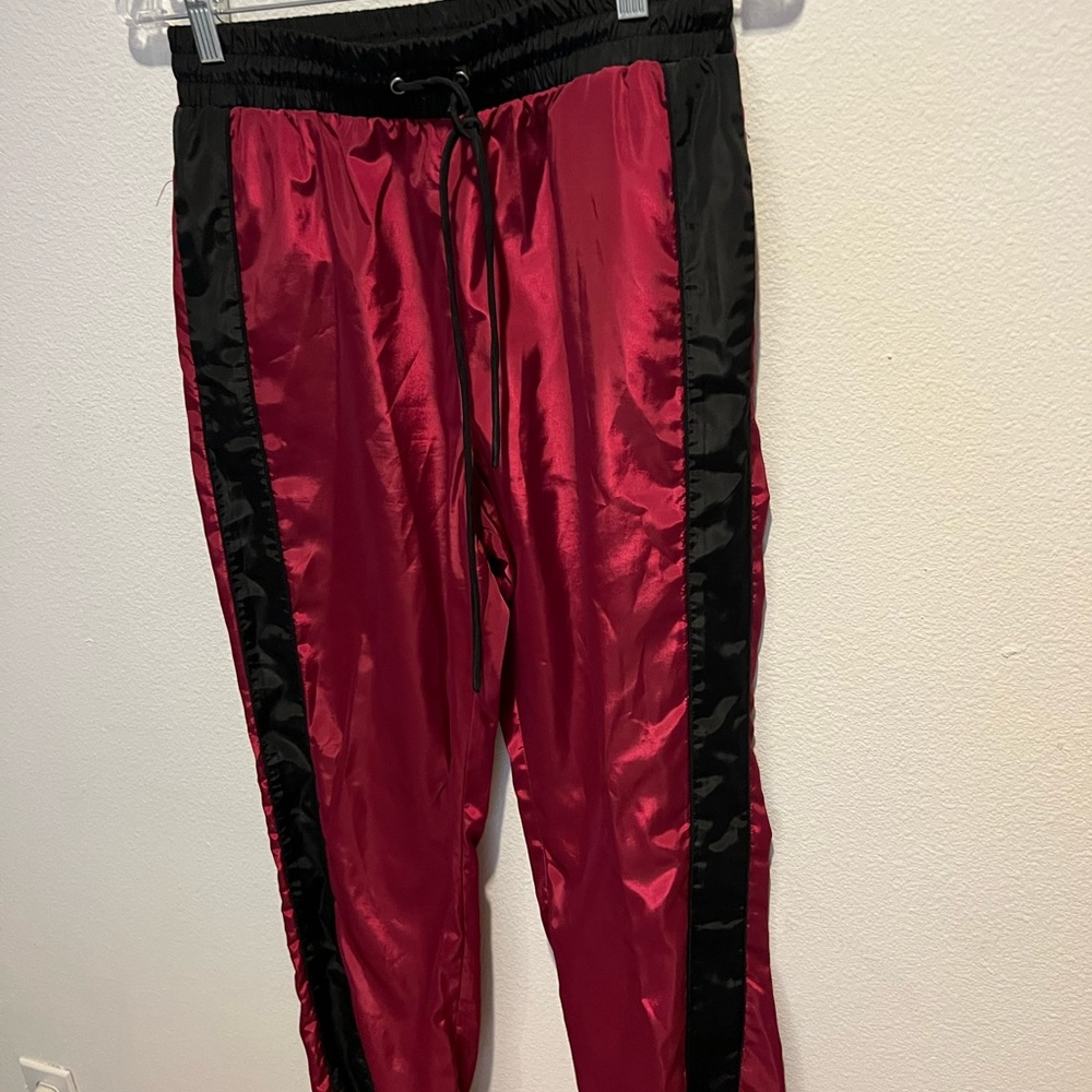 red and black track pants